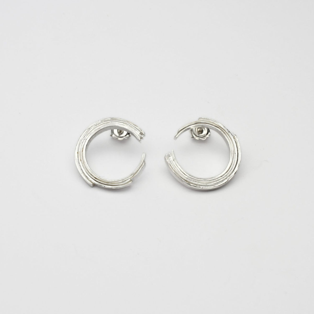 Brushstroke full arc earrings, sterling silver — the full sweep of a single painted line — Clustdlysau Arian