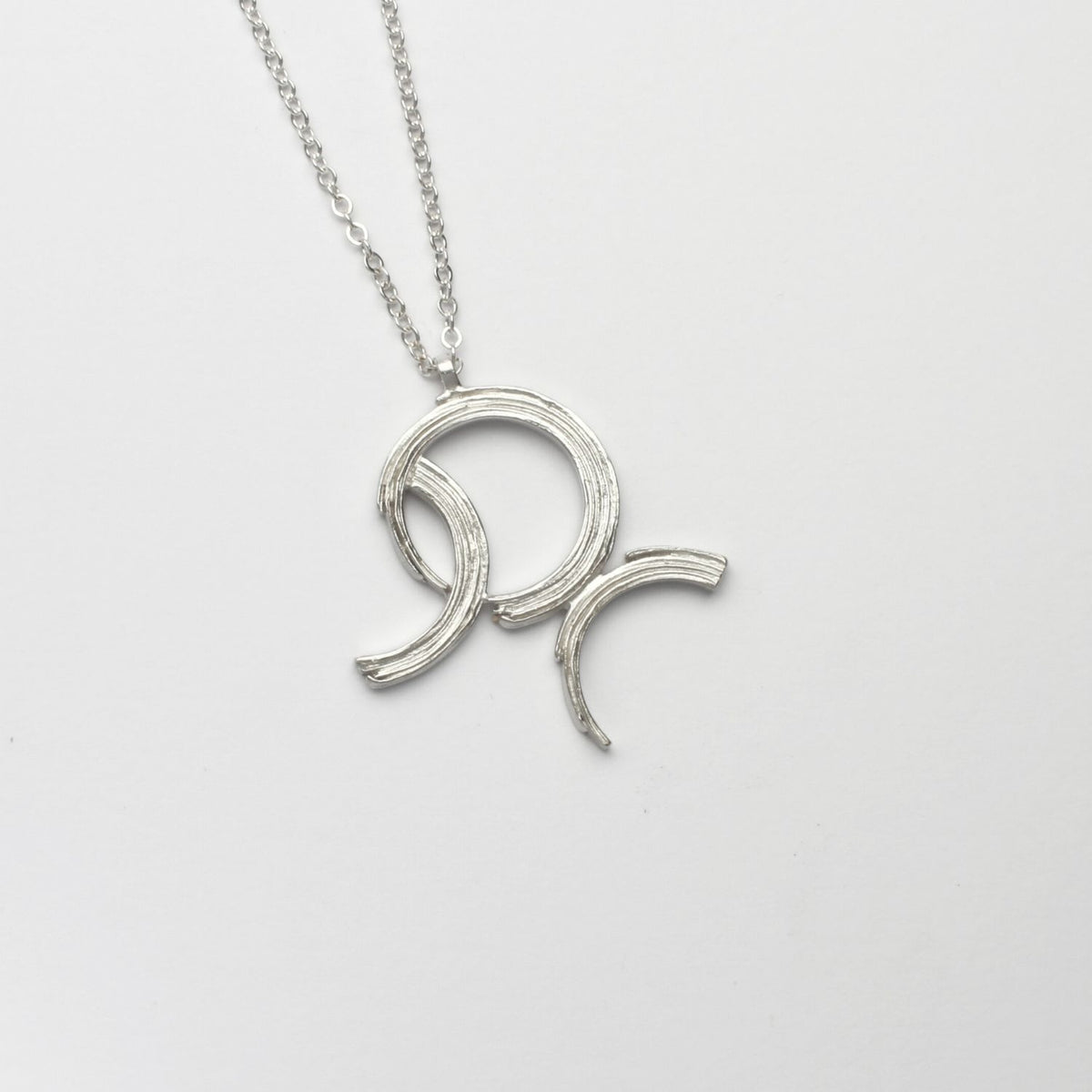 Brushstroke large pendant, sterling silver — a bold sweep of paint cast in metal — Mwclis Arian