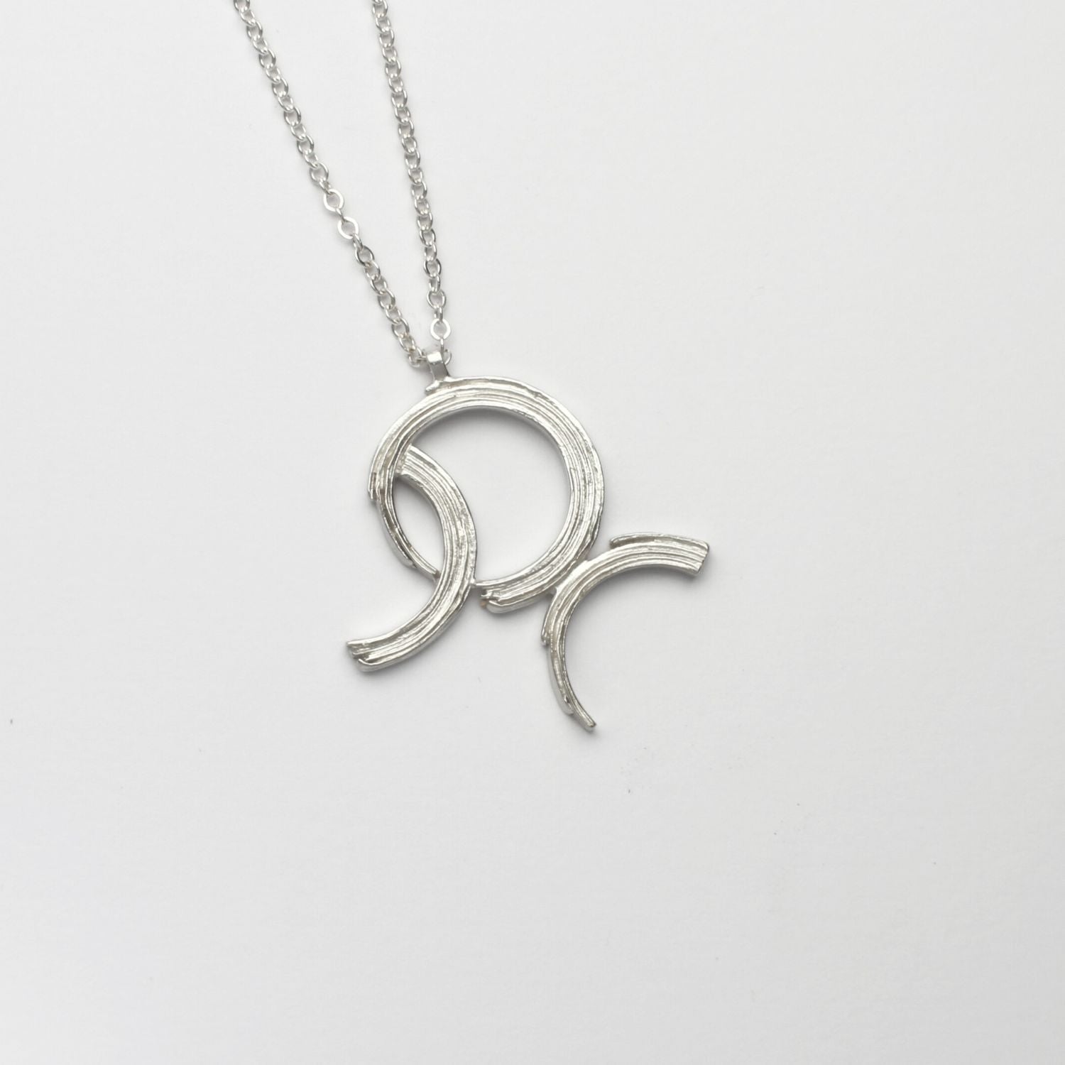 Brushstroke large pendant, sterling silver — a bold sweep of paint cast in metal — Mwclis Arian