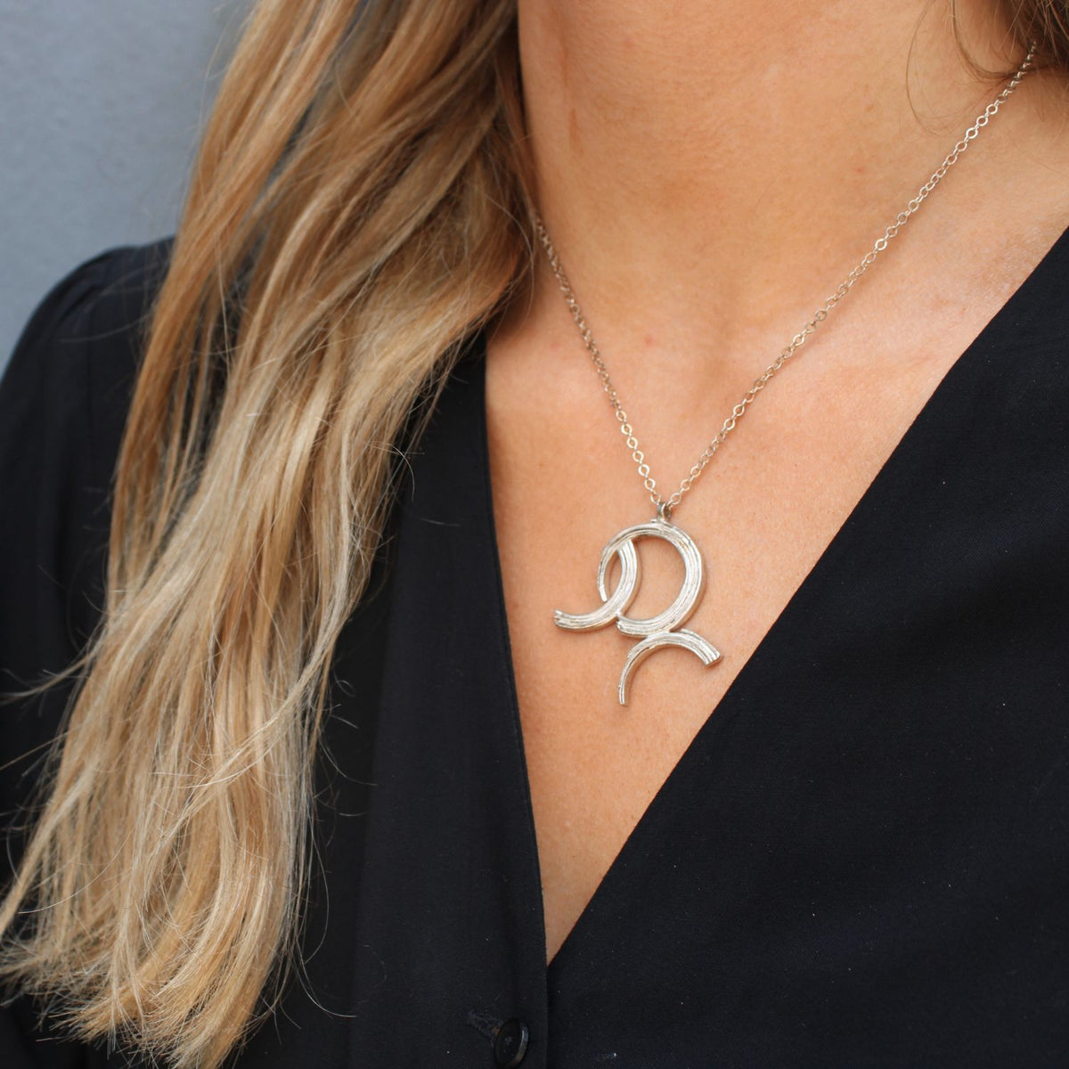 Model wearing the Brushstroke large pendant — Mwclis Arian