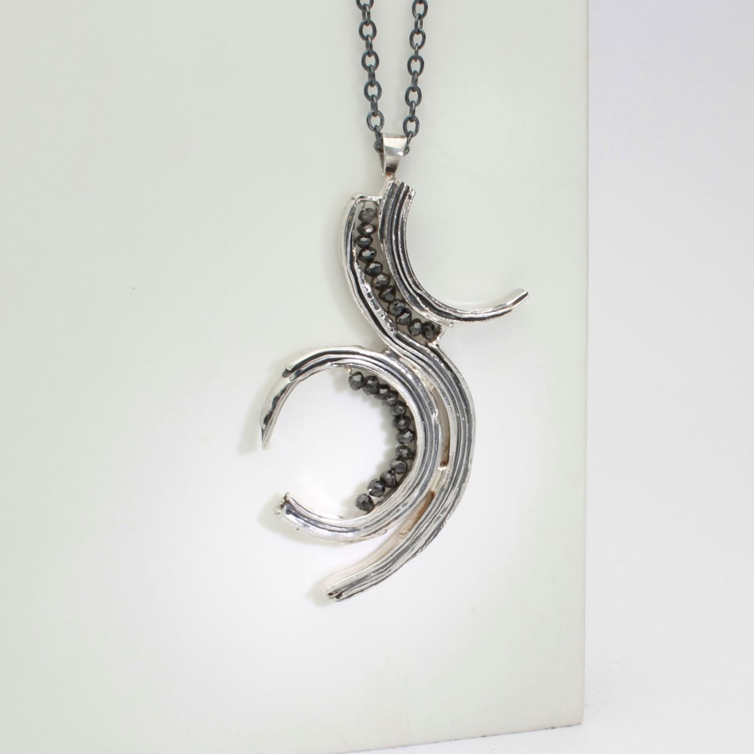 Brushstroke pendant in black oxidised silver with black diamonds, alternate view