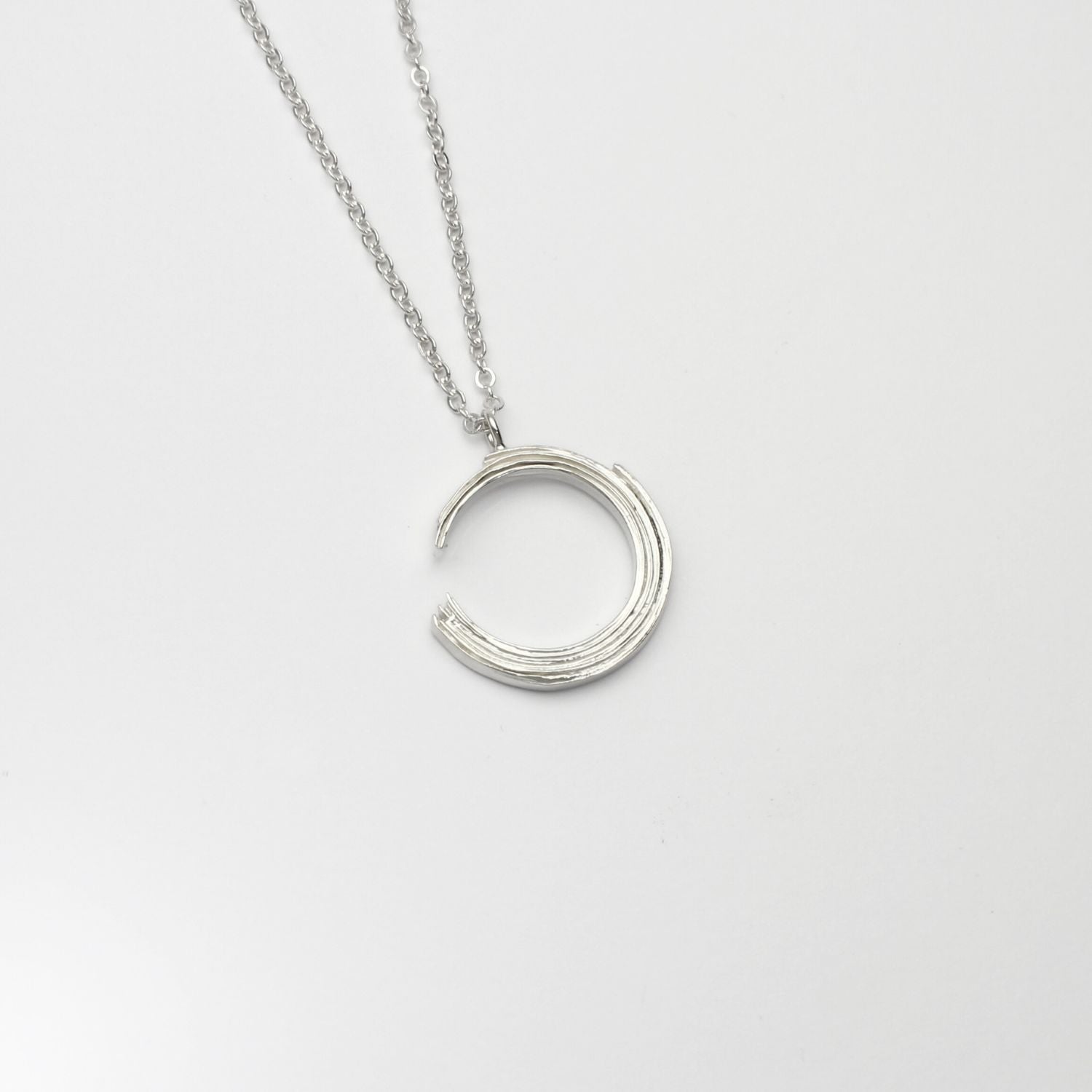 Brushstroke small pendant, sterling silver — a single considered stroke of paint cast in metal — Mwclis Arian