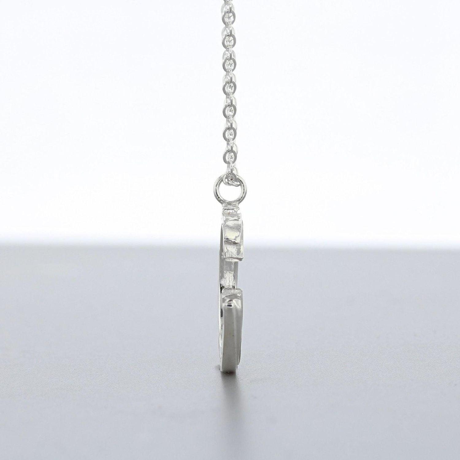 Brushstroke pendant hanging on its chain — Mwclis Arian