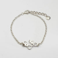 Bubbles charm bracelet, sterling silver — clustered circles inspired by rising champagne bubbles — Breichled Arian