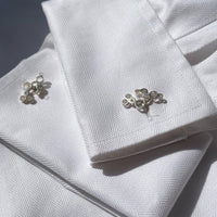 Bubbles cufflinks fastened on a shirt cuff, celebration-inspired design — Botymau Coesau Arian