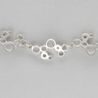 Side angle of the Bubbles linked bracelet, celebration-inspired design — Breichled Arian