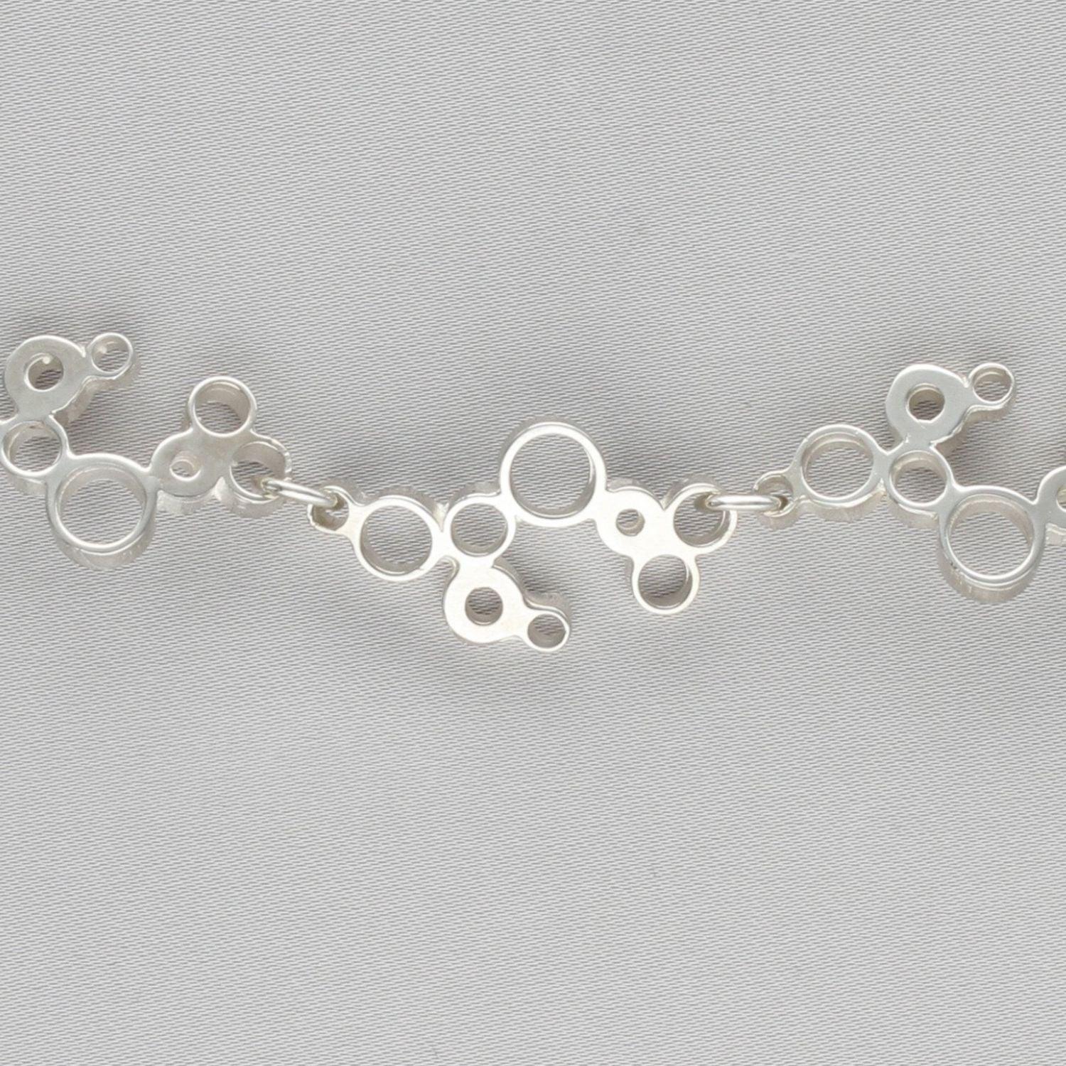 Side angle of the Bubbles linked bracelet, celebration-inspired design — Breichled Arian