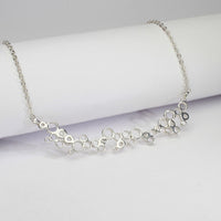 One of a kind Bubbles necklace, sterling silver and diamonds — clustered circles inspired by rising champagne bubbles — Mwclis Arian