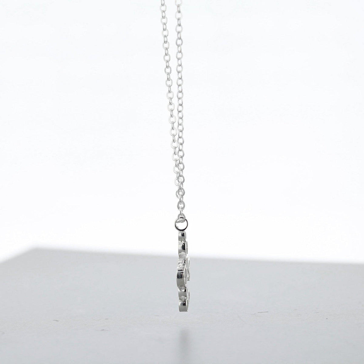 Close-up of the Bubbles pendant's clustered circles, echoing bubbles in a glass — Mwclis Arian