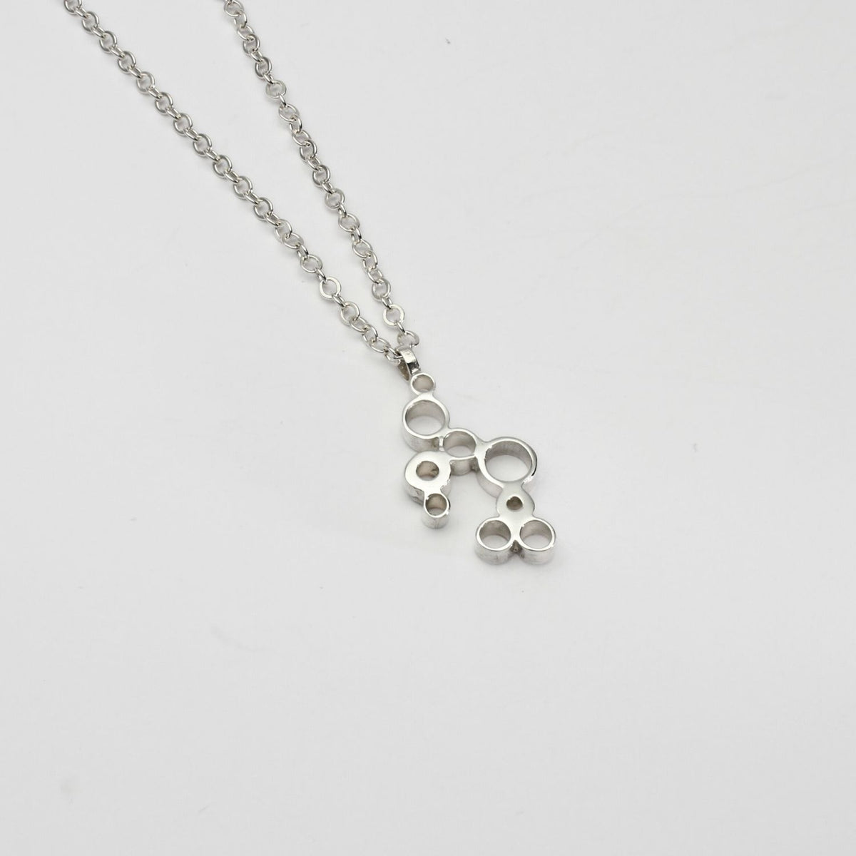 Bubbles pendant, sterling silver — clustered circles inspired by rising champagne bubbles, front view — Mwclis Arian