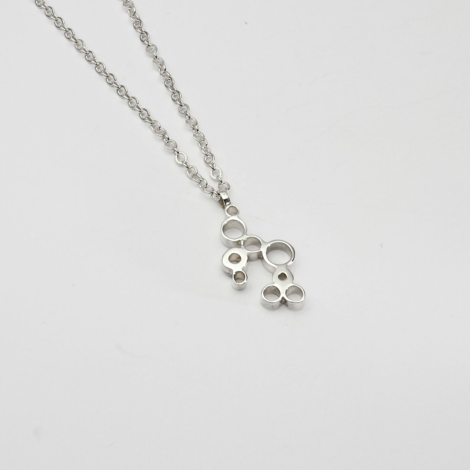 Bubbles pendant, sterling silver — clustered circles inspired by rising champagne bubbles, front view — Mwclis Arian