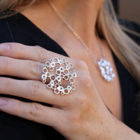 Model wearing the Bubbles statement ring, celebration-inspired design — Modrwy Arian