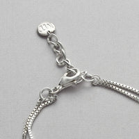 Close-up on the carthen pattern of the Caernarfon long bracelet — Breichled Arian