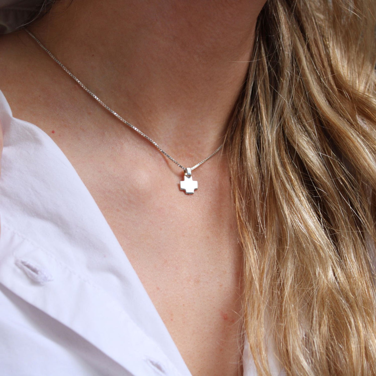 Model wearing the Carthenni cross pendant, rooted in hiraeth — Mwclis Arian