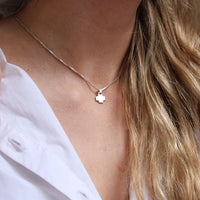 Model wearing the Carthenni cross pendant, rooted in hiraeth — Mwclis Arian