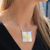 Carthenni Embossed: Plaid Design - Statement silver and gold pendant