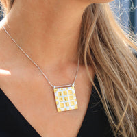 Carthenni Embossed: Portcullis Design - Large silver and gold pendant