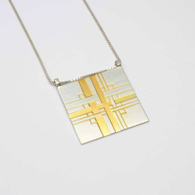 Carthenni Embossed: Plaid Design - Statement silver and gold pendant