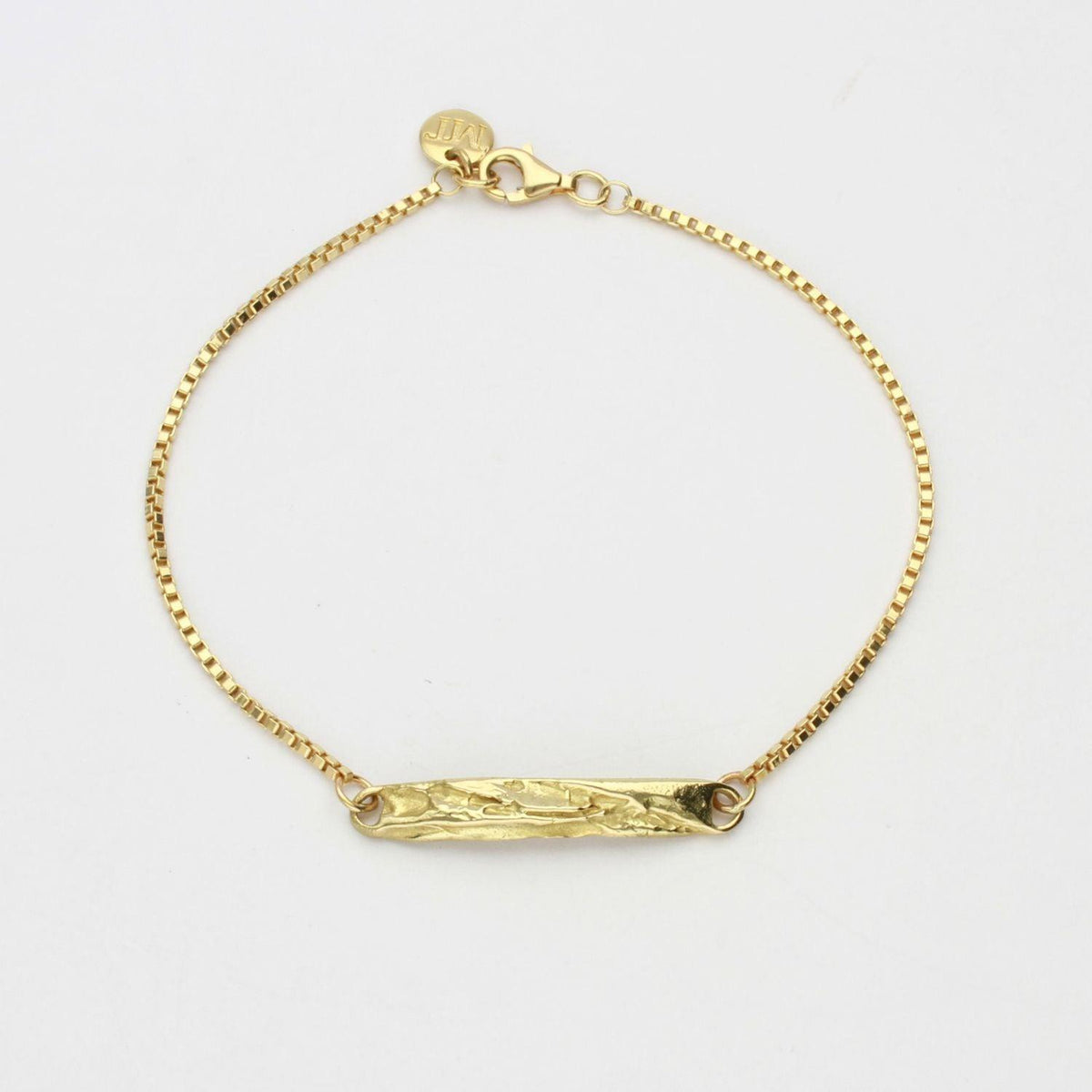 Contemporary Welsh gold jewellery designed and made in Wales and inspired by the Welsh landscape. the bracelet is handcarved in 18ct yellow gold 