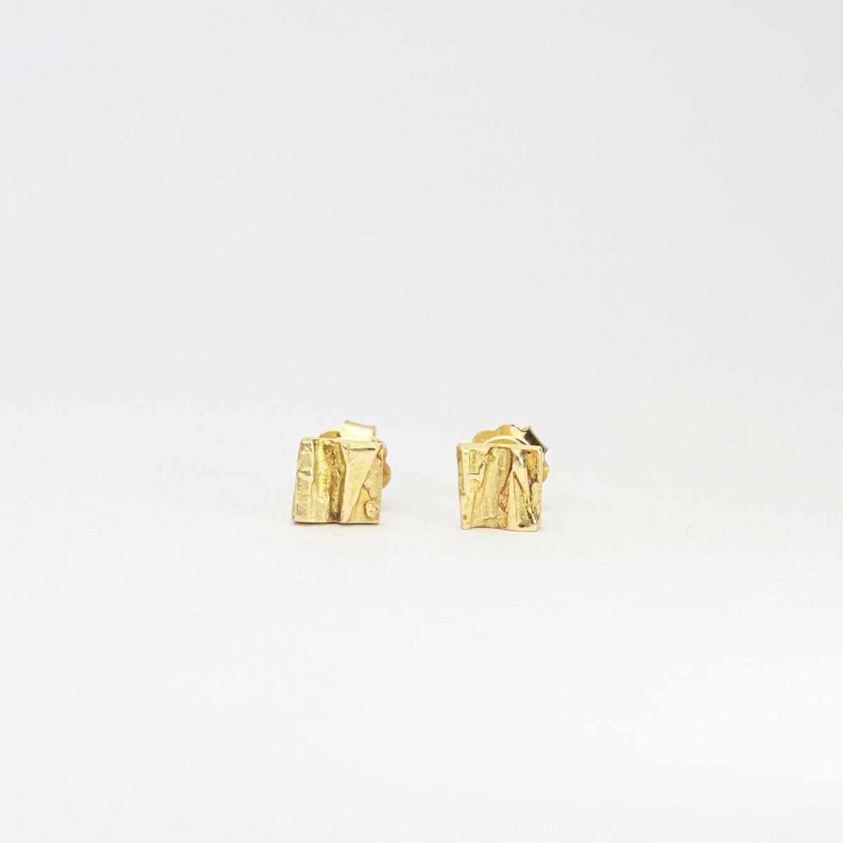 Contemporary Welsh gold jewellery designed and made in Wales and inspired by the Welsh landscape  handcrafted stud earrings in solid 18ct yellow gold 