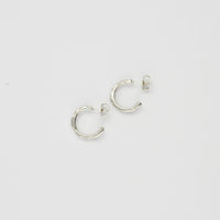 Carved sterling silver hoop earrings, top view