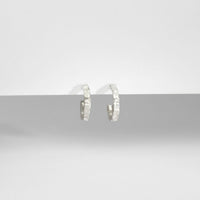 Carved sterling silver hoop earrings, nature-inspired texture