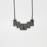 Carved: Black Silver Arc necklace