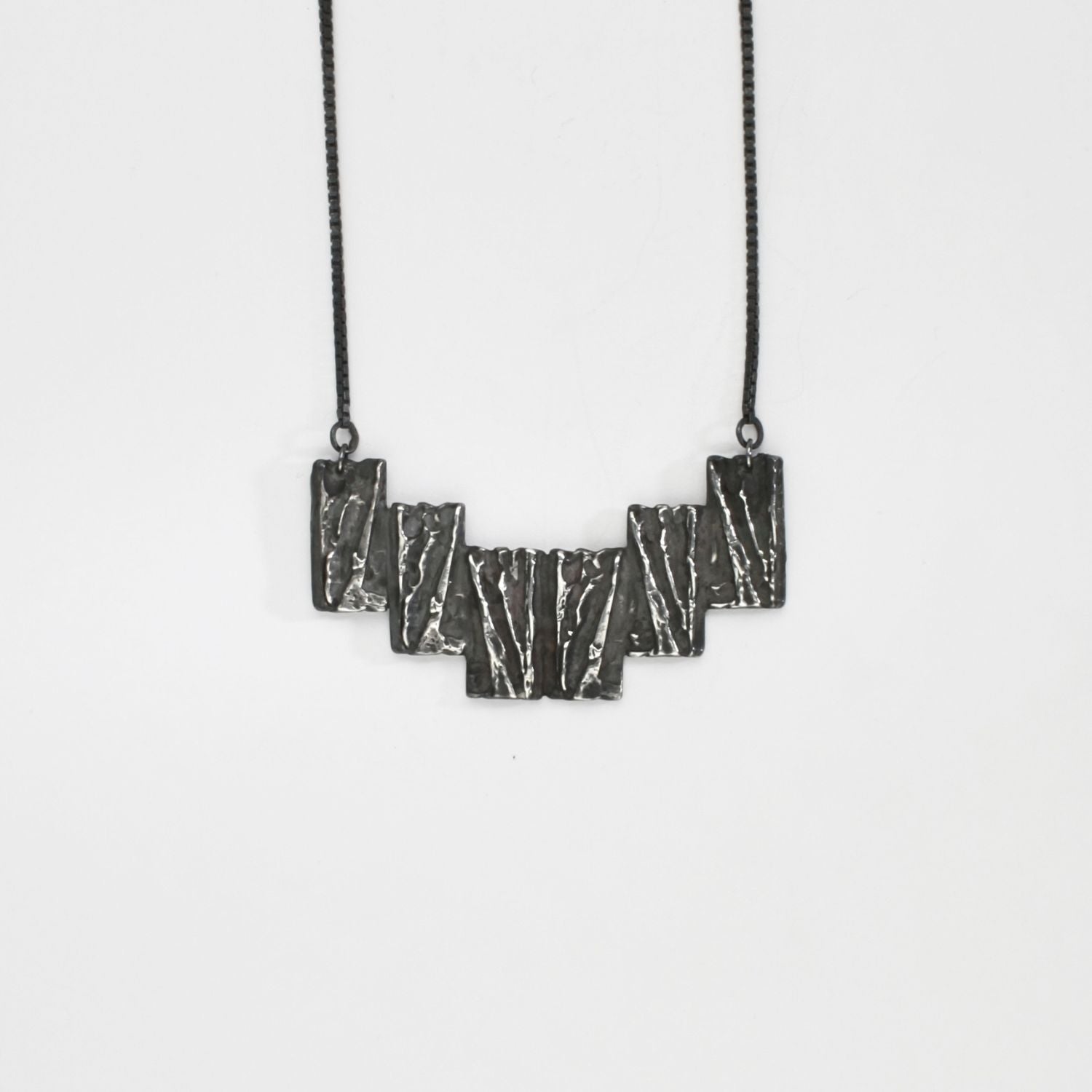 Carved: Black Silver Arc necklace