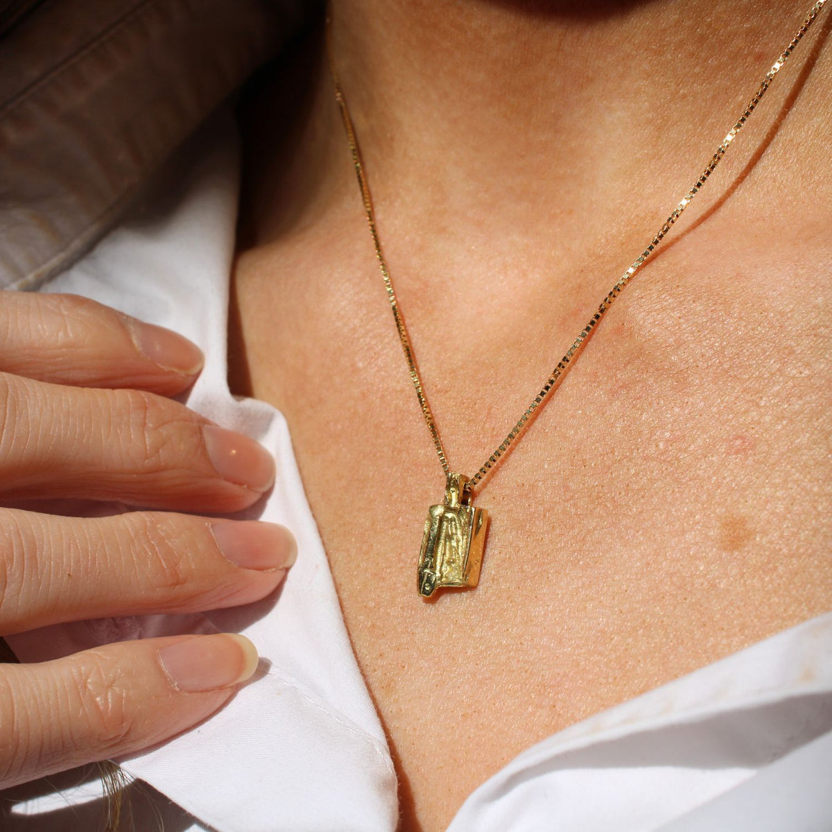 Shown on model. Contemporary Welsh gold jewellery designed and made in Wales and inspired by the Welsh landscape. The necklace is handcrafted in 18ct yellow gold 