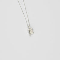 Small carved silver pendant
