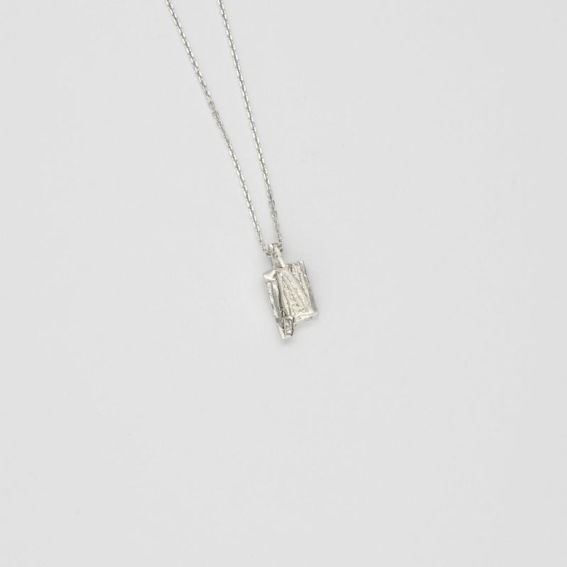 Small carved silver pendant
