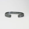 Contemporary Welsh silver jewellery. Inspired by the beautiful landscape of Wales especially slate and coal. This torque cuff bangle is designed and handmade in Wales. Suitable for men or women. Front view