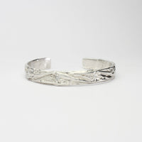 Contemporary Welsh silver jewellery. Inspired by the beautiful landscape of Wales. This torque cuff bangle is designed and handmade in Wales. Suitable for men or women.