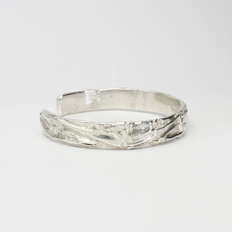 Contemporary Welsh silver jewellery. Inspired by the beautiful landscape of Wales. This torque cuff bangle is designed and handmade in Wales. Suitable for men or women.