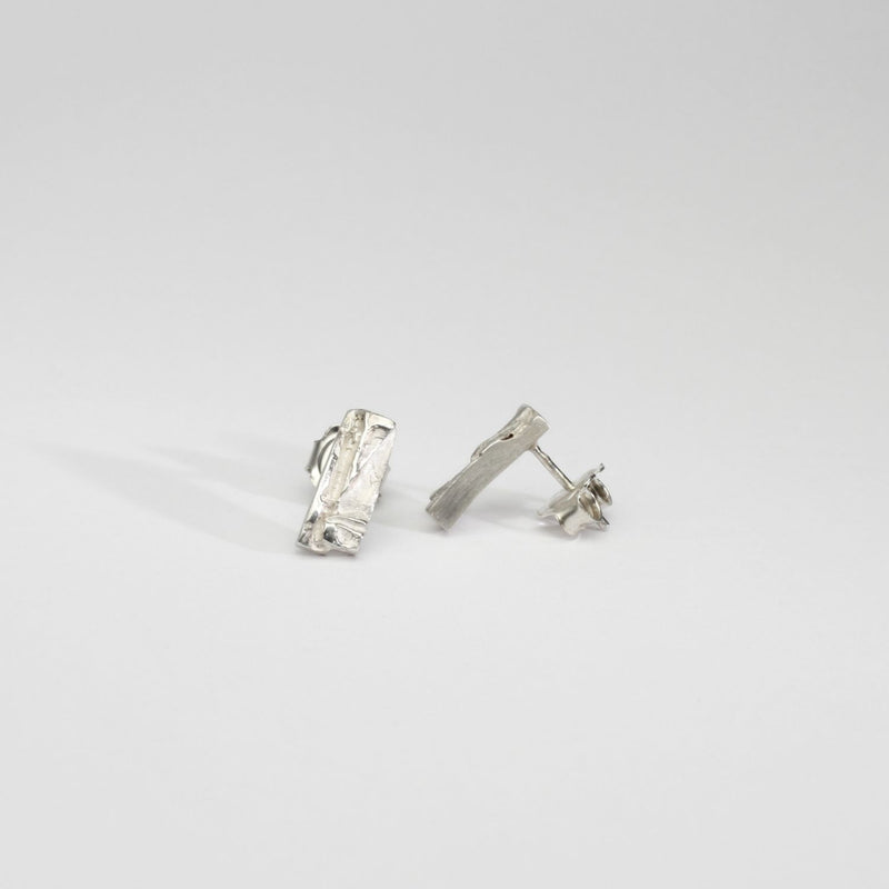 Contemporary Welsh silver jewellery. Inspired by the beautiful landscape of Wales.  These small textured rectangular stud earrings are designed and handmade in Wales