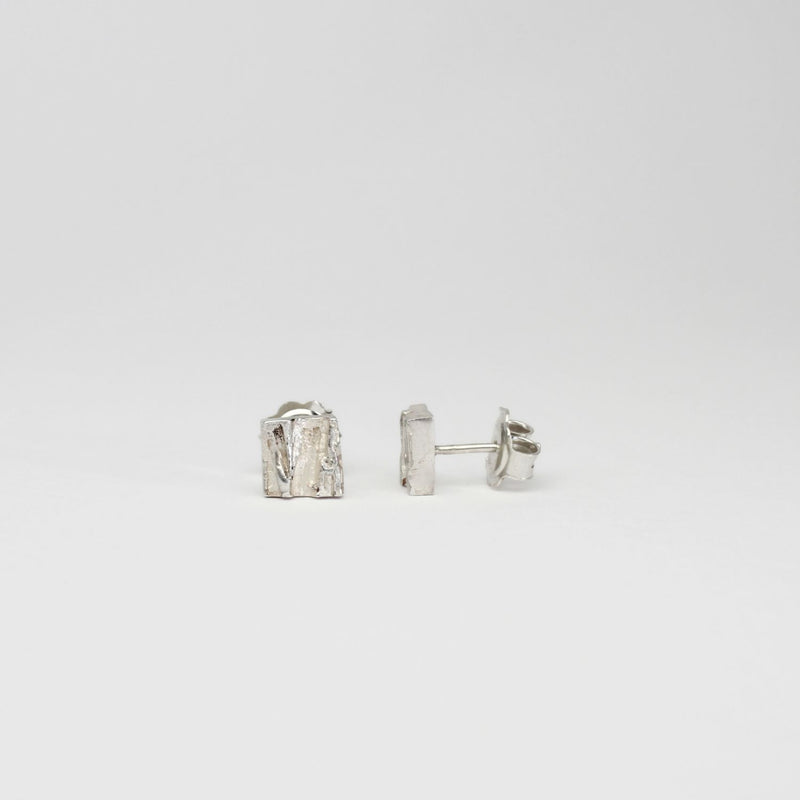 Contemporary Welsh silver jewellery. Inspired by the beautiful landscape of Wales.  These small textured square stud earrings are designed and handmade in Wales