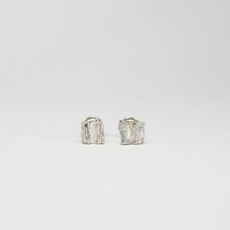 Contemporary Welsh silver jewellery. Inspired by the beautiful landscape of Wales.  These small textured square stud earrings are designed and handmade in Wales