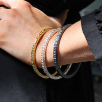 Model wearing the Cofio bangle, a line of Welsh poetry on the wrist — Breichled Arian