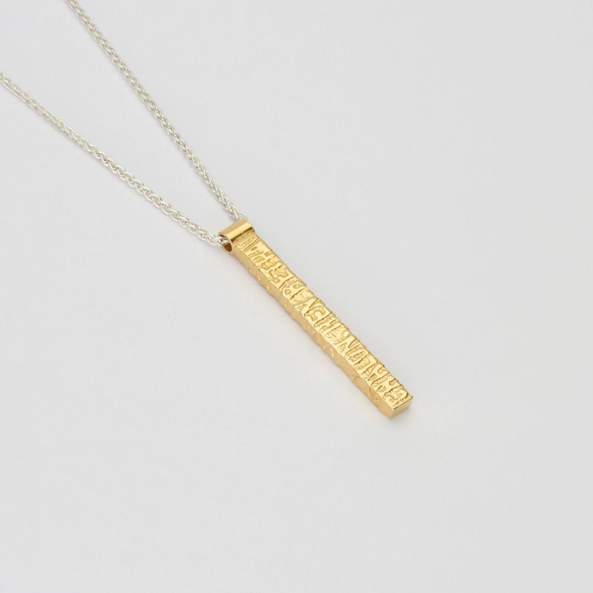Cofio pendant, silver and 18ct gold plated silver — Waldo Williams's words cast in metal — Mwclis Arian ac Aur