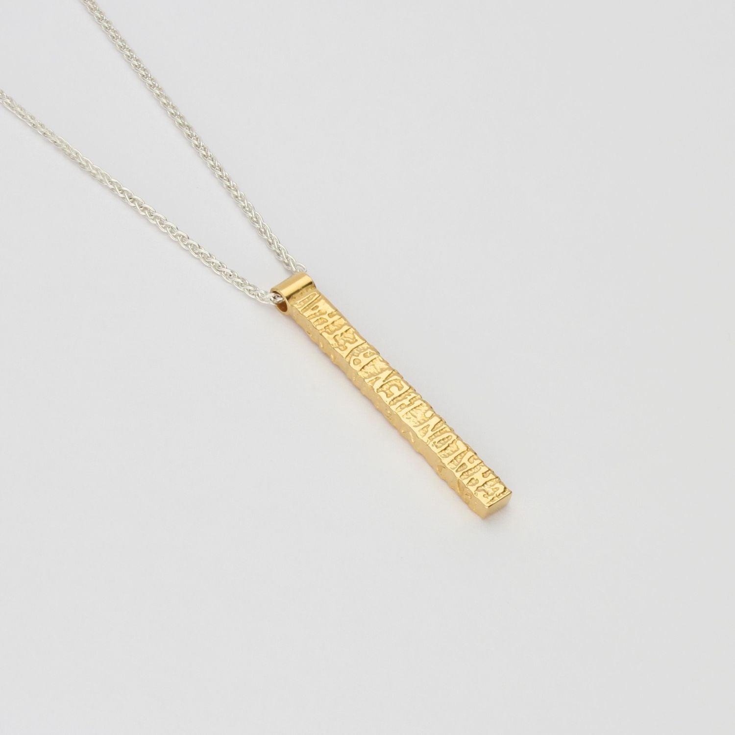 Cofio pendant, silver and 18ct gold plated silver — Waldo Williams's words cast in metal — Mwclis Arian ac Aur