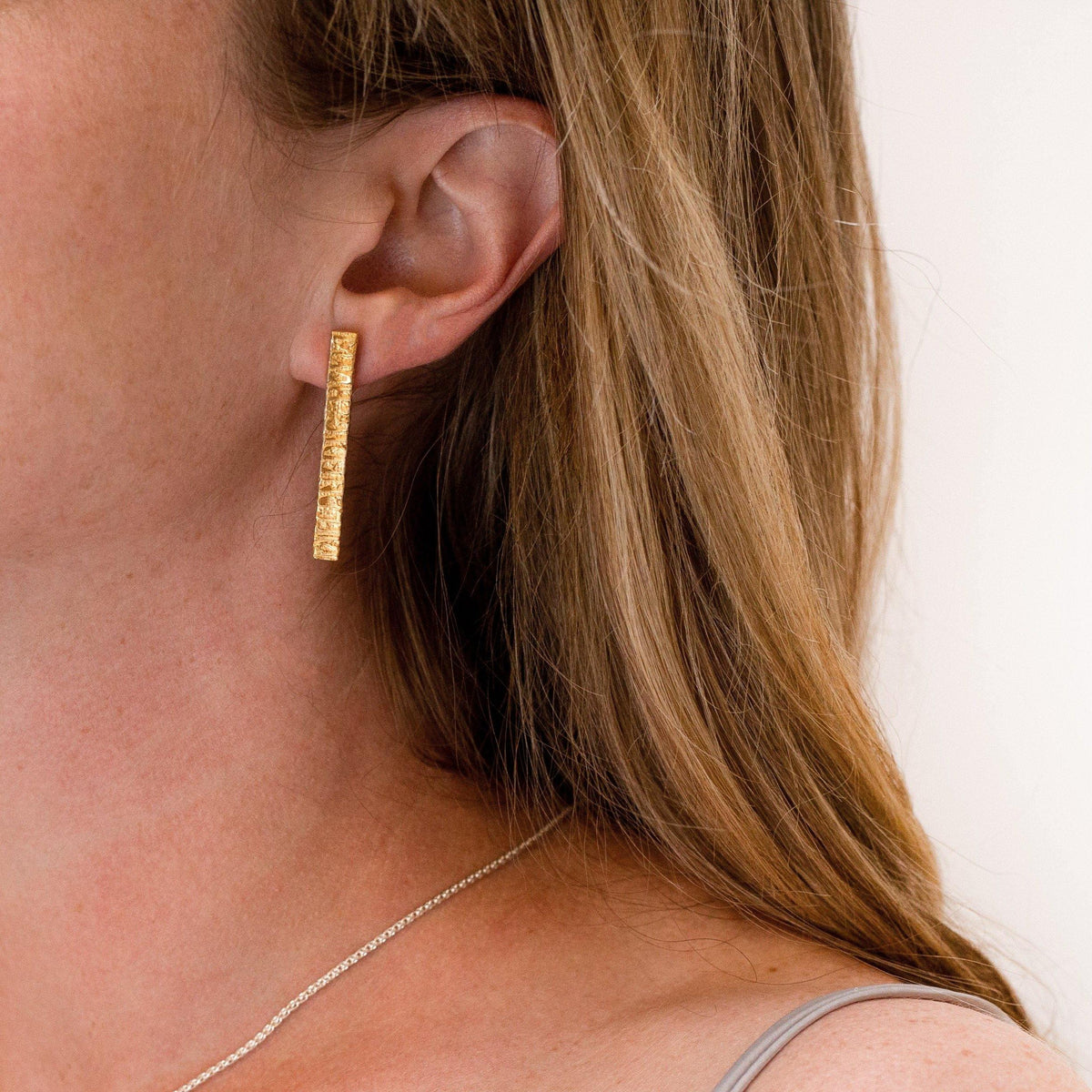 Side view of the Cofio long earrings, a verse of remembrance — Clustdlysau Arian ac Aur
