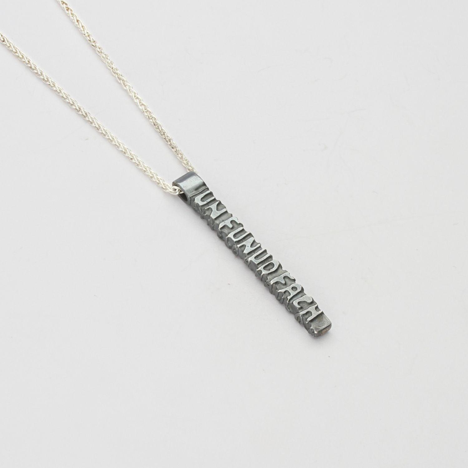 Cofio pendant, black oxidised silver — Waldo Williams's words cast in metal — Mwclis Arian