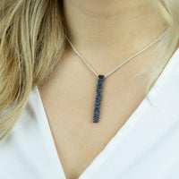 Side view of the Cofio black pendant, tracing a verse of remembrance — Mwclis Arian