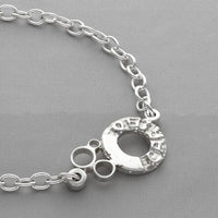 Dathlu Celebration sterling silver charm bracelet, on wrist