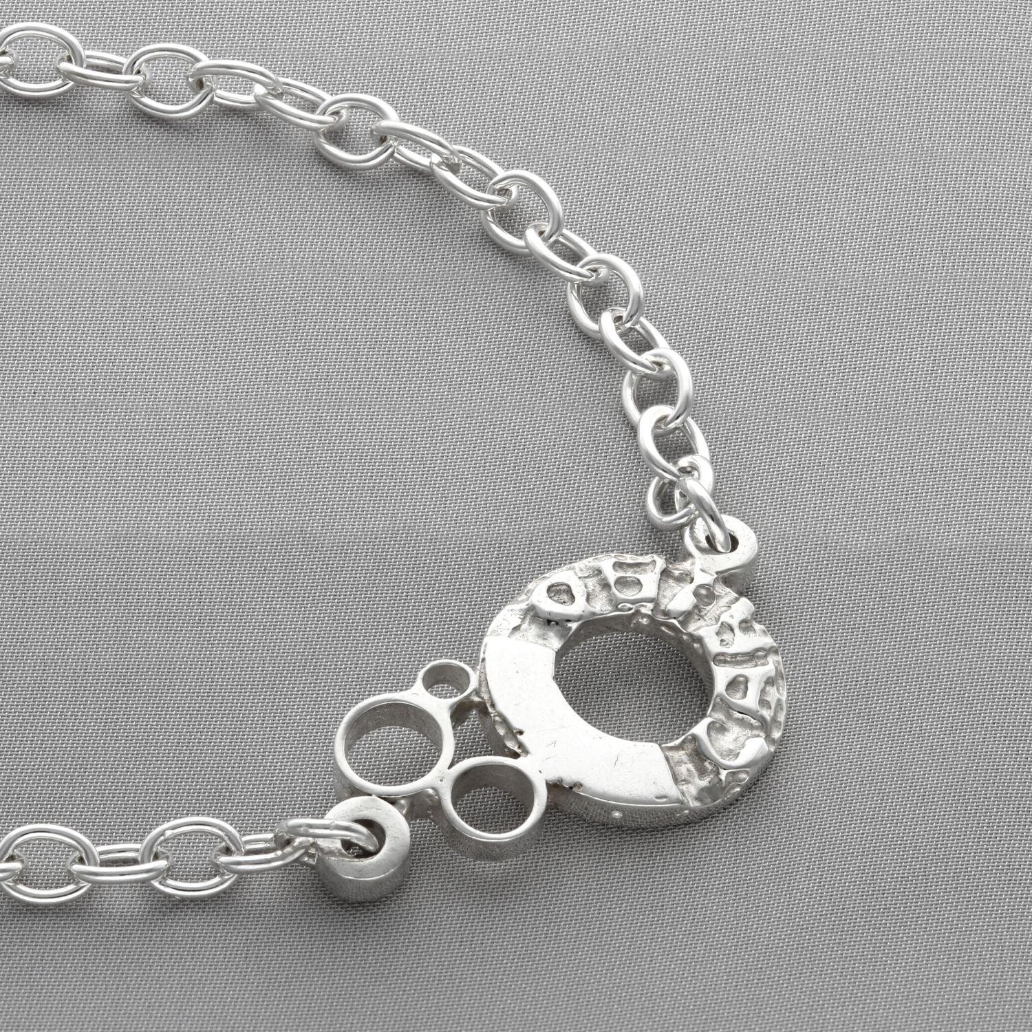Dathlu Celebration sterling silver charm bracelet, on wrist