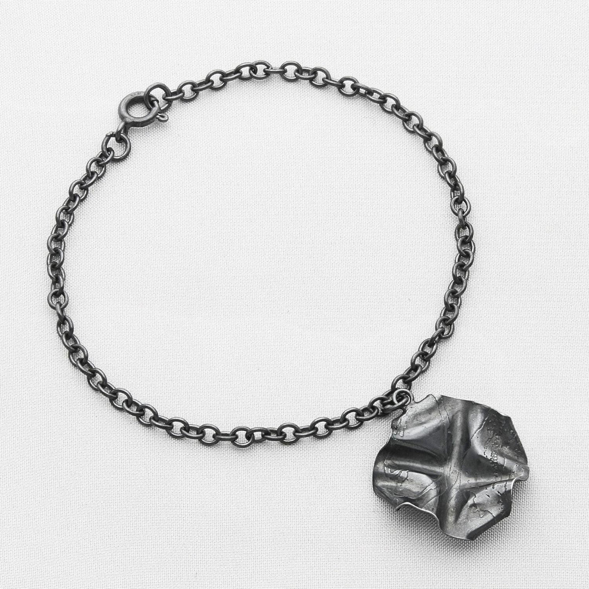 Decorative Concepts charm bracelet, black oxidised silver — a mark drawn from Mari's sketchbook — Breichled Arian