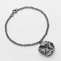Decorative Concepts charm bracelet, black oxidised silver — a mark drawn from Mari's sketchbook — Breichled Arian