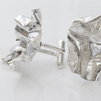 Side view of the Decorative Concepts cufflinks, echoing a pencil-drawn line — Botymau Coesau Arian