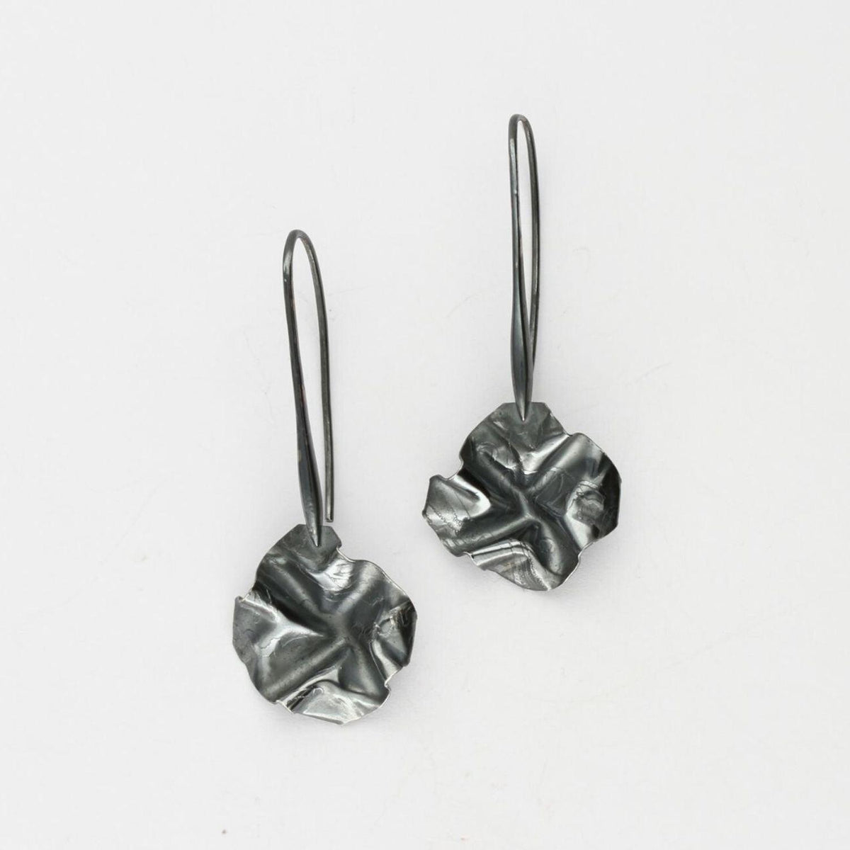 Decorative Concepts drop earrings, black oxidised silver — tracing the shape of a sketched line on paper — Clustdlysau Arian
