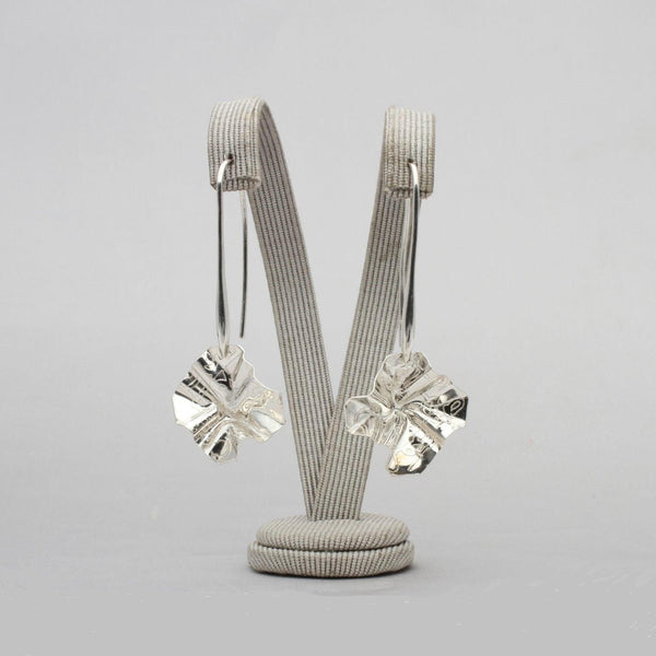 Decorative Concepts drop earrings, tracing the shape of a sketched line on paper — Clustdlysau Arian